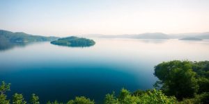 Calm lake and mountains illustrating peace and emotional well-being.